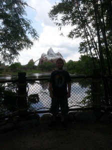 Our son, Josiah, standing in front of the awesome view of Expedition Everest from the back of Flame Tree BBQ - an incredibly peaceful spot!